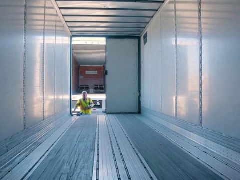 All Fleet Inc technician inspecting the inside of an empty trailer
