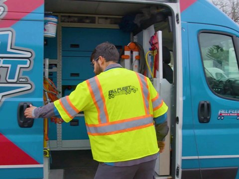 All Fleet Inc technician opening the side door of a stocked All Fleet Inc service van
